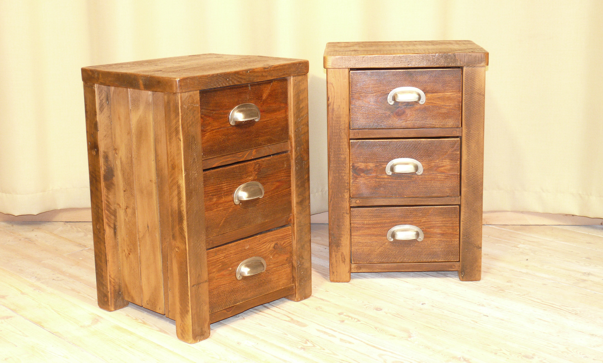 Two triple draw bedside cabinets